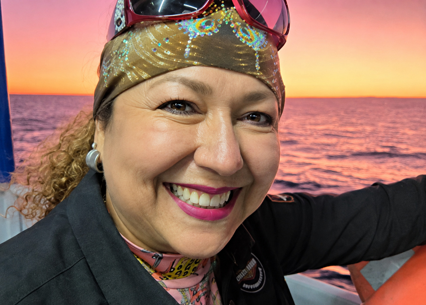 Guest smiling during a Rocky Point sunset cruise